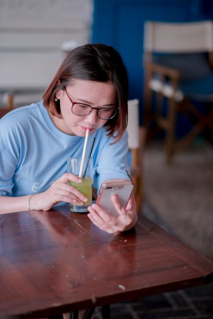 People chatting and drinking coffee in a cafe setting